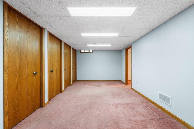 1569 Sheffield Dr, Ypsilanti, MI 48198 - finished basement with light carpet, baseboards, and a paneled ceiling