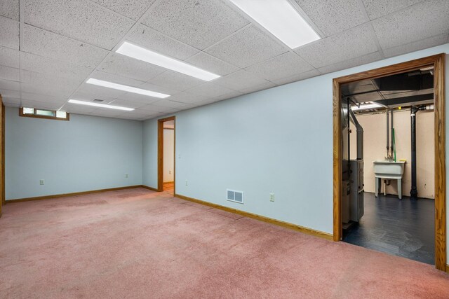 1569 Sheffield Dr, Ypsilanti, MI 48198 - carpeted spare room with baseboards and a paneled ceiling
