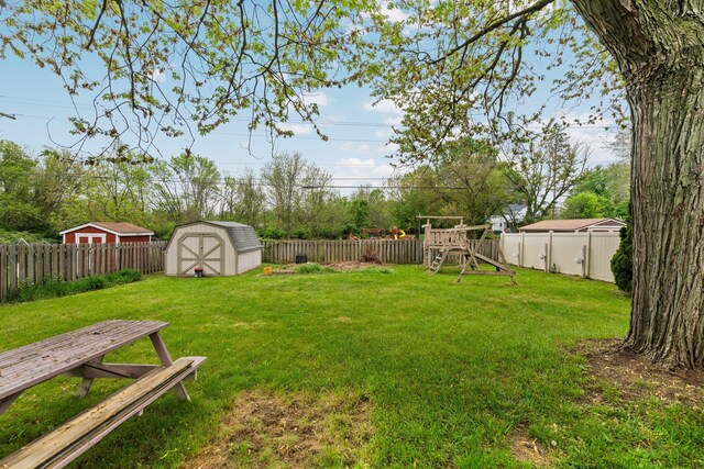 1569 Sheffield Dr, Ypsilanti, MI 48198 - view of yard with a storage unit, a playground, and an outdoor structure