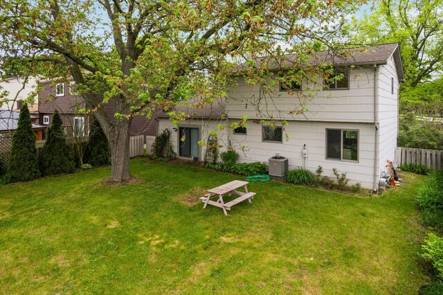 1569 Sheffield Dr, Ypsilanti, MI 48198 - rear view of house with central AC unit