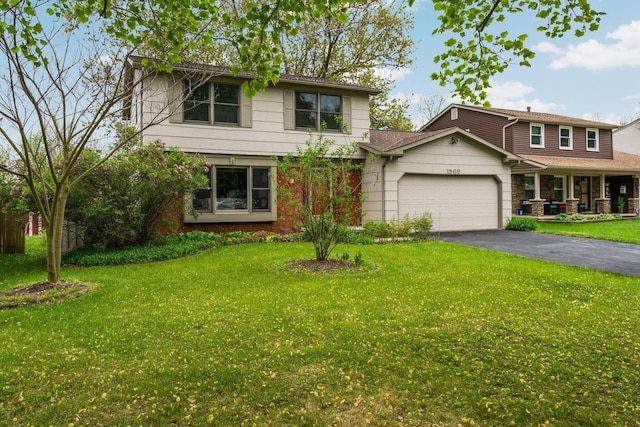1569 Sheffield Dr, Ypsilanti, MI 48198 - view of front of home featuring a garage, asphalt driveway, and a front yard