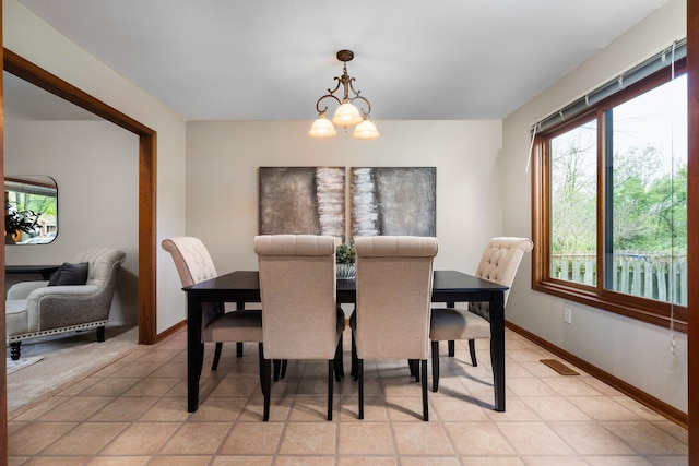 1569 Sheffield Dr, Ypsilanti, MI 48198 - dining space featuring plenty of natural light, a chandelier, and baseboards