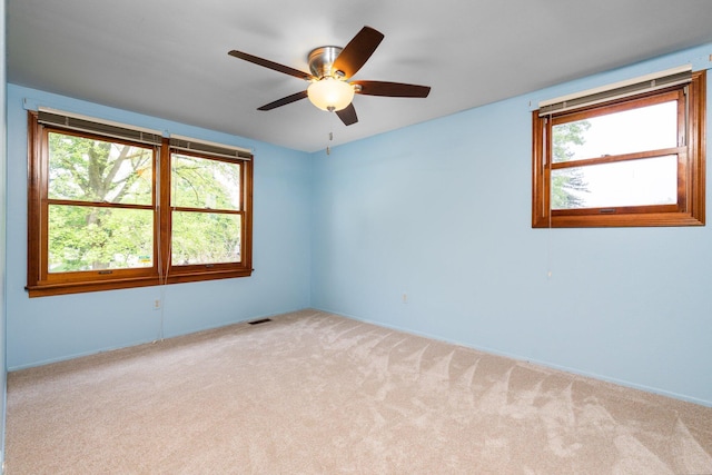 1569 Sheffield Dr, Ypsilanti, MI 48198 - unfurnished room featuring light colored carpet, ceiling fan, and baseboards