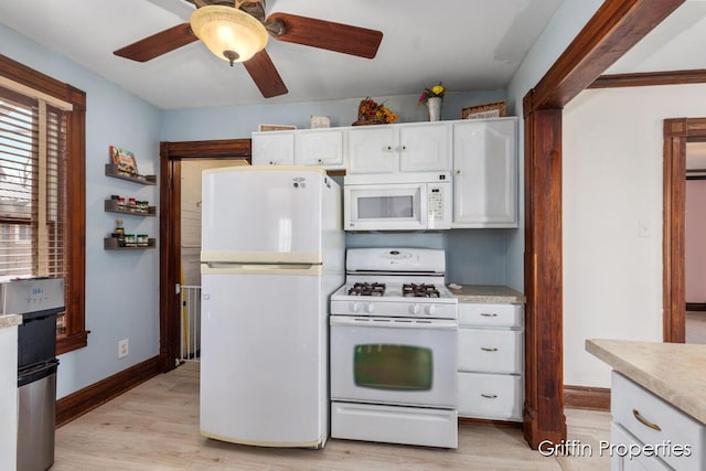 kitchen featuring white appliances, white cabinetry, light countertops, ceiling fan, and light wood finished floors