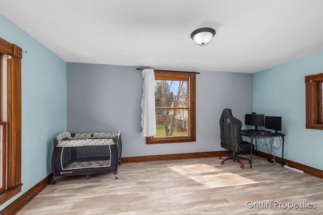 office space featuring wood finished floors and baseboards
