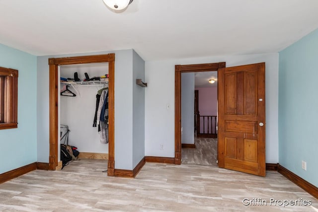 interior space with light wood-type flooring and baseboards