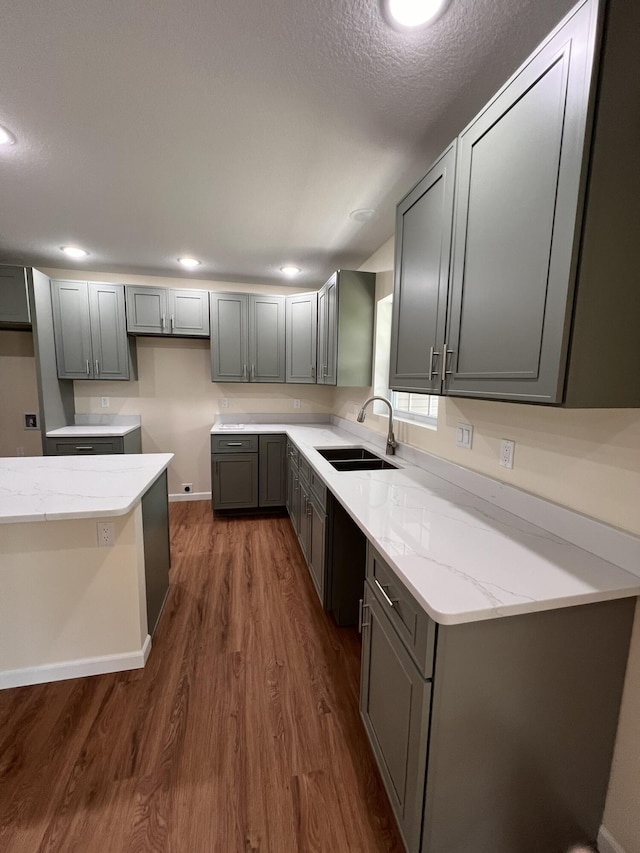 4745 Keith Rd, Hillsdale, MI 49242 - kitchen with a sink, dark wood finished floors, light stone counters, and baseboards