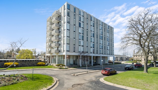 view of property featuring uncovered parking