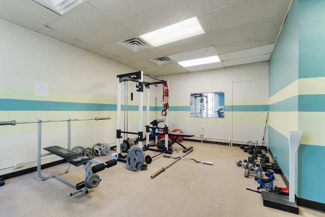 workout area featuring visible vents and a drop ceiling