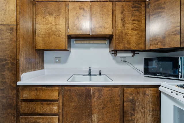 kitchen with light countertops and a sink