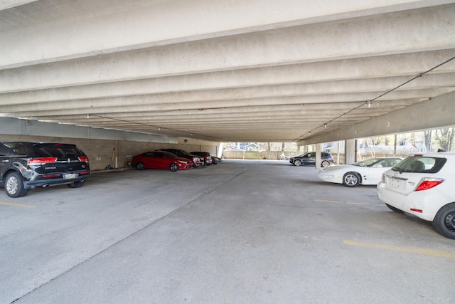 view of parking featuring a parking deck