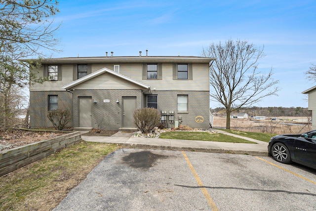 15330 Krueger St Unit 19, Spring Lake, MI 49456 - multi unit property featuring uncovered parking and brick siding