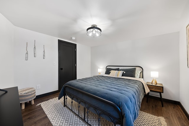 9442 Community Hall Rd, Union Pier, MI 49129 - bedroom featuring baseboards and wood finished floors