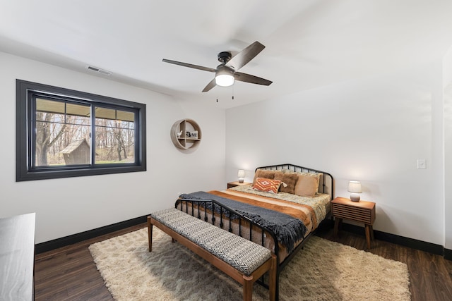 9442 Community Hall Rd, Union Pier, MI 49129 - bedroom featuring wood finished floors, ceiling fan, baseboards, and visible vents