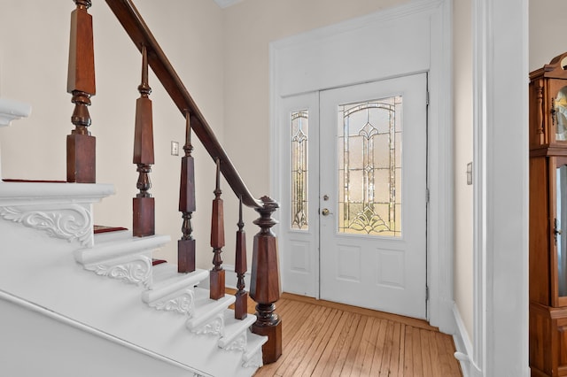 551 W Bridge St, Plainwell, MI 49080 - entrance foyer with stairway and light wood-style floors