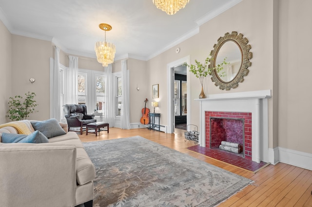 551 W Bridge St, Plainwell, MI 49080 - living area with a brick fireplace, a baseboard radiator, a chandelier, crown molding, and wood-type flooring