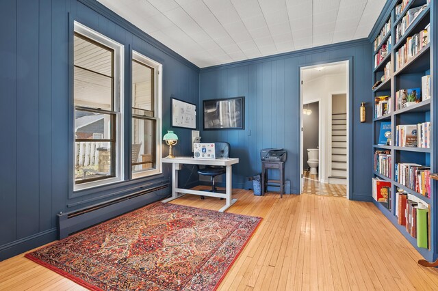 551 W Bridge St, Plainwell, MI 49080 - office area with hardwood / wood-style flooring, a baseboard heating unit, and crown molding