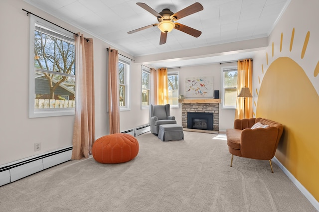 551 W Bridge St, Plainwell, MI 49080 - sitting room with a baseboard heating unit, carpet flooring, a fireplace, and a healthy amount of sunlight