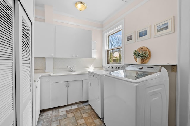 551 W Bridge St, Plainwell, MI 49080 - laundry area featuring crown molding, separate washer and dryer, a sink, and cabinet space