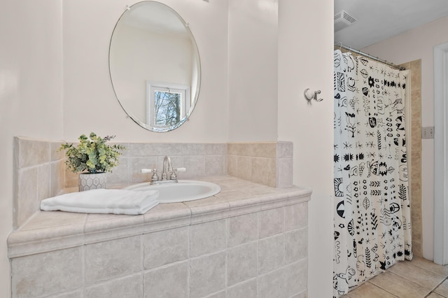 551 W Bridge St, Plainwell, MI 49080 - bathroom featuring tile patterned floors, a shower with curtain, a sink, and visible vents