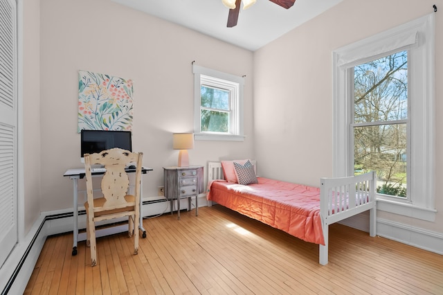 551 W Bridge St, Plainwell, MI 49080 - bedroom with light wood-type flooring and a ceiling fan