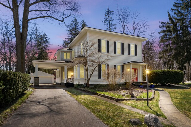 551 W Bridge St, Plainwell, MI 49080 - italianate-style house with driveway and an outdoor structure