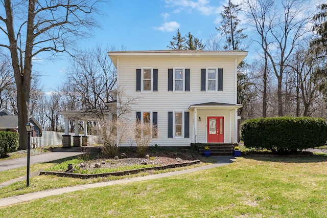 551 W Bridge St, Plainwell, MI 49080 - italianate-style house with driveway, fence, and a front lawn