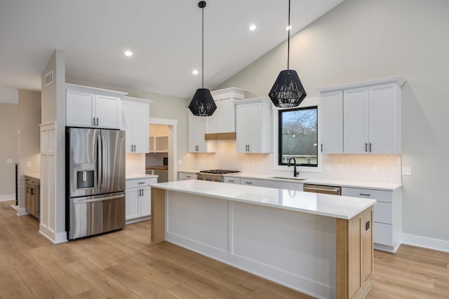 7701 Fase St SE Lot 15, Ada, MI 49301 - kitchen with a sink, appliances with stainless steel finishes, a kitchen island, and tasteful backsplash