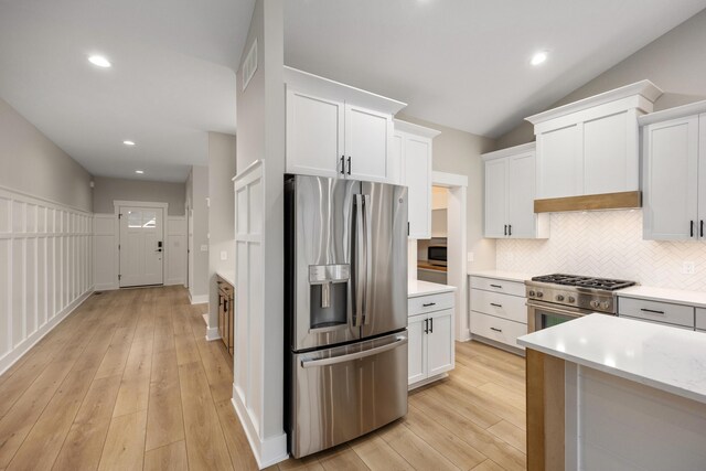 7701 Fase St SE Lot 15, Ada, MI 49301 - kitchen with light countertops, appliances with stainless steel finishes, light wood-type flooring, and tasteful backsplash