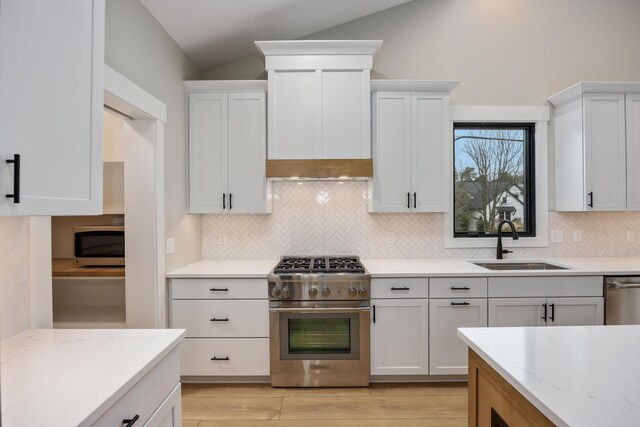 7701 Fase St SE Lot 15, Ada, MI 49301 - kitchen featuring a sink, appliances with stainless steel finishes, backsplash, and white cabinets