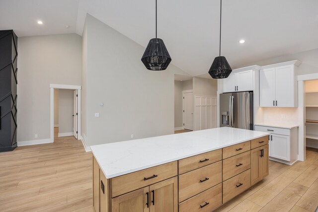 7701 Fase St SE Lot 15, Ada, MI 49301 - kitchen featuring light countertops, stainless steel refrigerator with ice dispenser, white cabinetry, and light wood-style floors