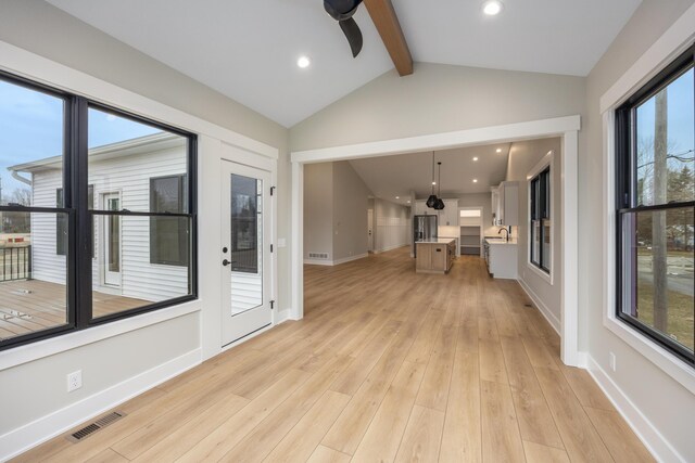 7701 Fase St SE Lot 15, Ada, MI 49301 - unfurnished sunroom with visible vents, a sink, and beamed ceiling
