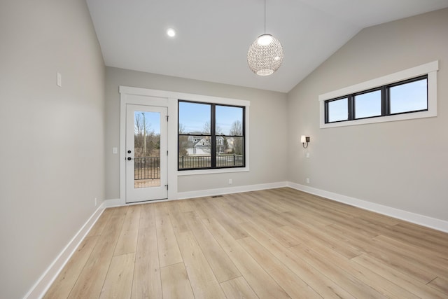 7701 Fase St SE Lot 15, Ada, MI 49301 - spare room featuring recessed lighting, baseboards, light wood-type flooring, and lofted ceiling