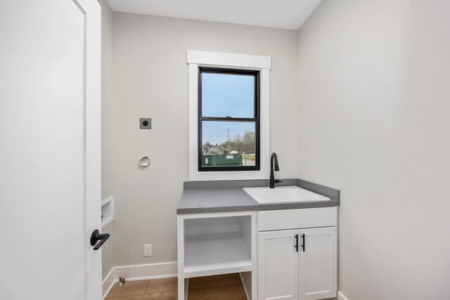 7701 Fase St SE Lot 15, Ada, MI 49301 - interior space with baseboards, electric dryer hookup, a sink, and cabinet space