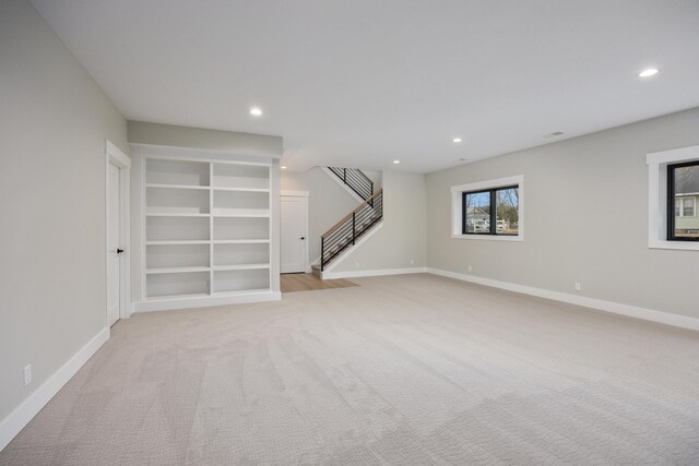 7701 Fase St SE Lot 15, Ada, MI 49301 - empty room featuring recessed lighting, stairs, baseboards, and light carpet