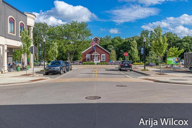 7701 Fase St SE Lot 15, Ada, MI 49301 - view of street with street lighting, traffic signs, sidewalks, and curbs