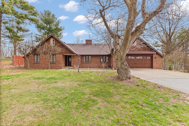 4675 Treat Hwy, Adrian, MI 49221 - view of front of home with concrete driveway, a chimney, fence, and an attached garage