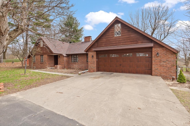 4675 Treat Hwy, Adrian, MI 49221 - view of front facade featuring brick siding, a chimney, a garage, and concrete driveway