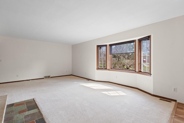 4675 Treat Hwy, Adrian, MI 49221 - empty room featuring visible vents, baseboards, and carpet floors