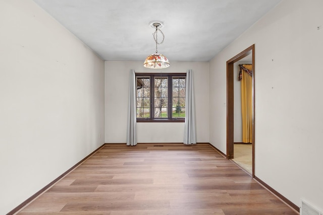 4675 Treat Hwy, Adrian, MI 49221 - empty room with visible vents, light wood-style flooring, and baseboards