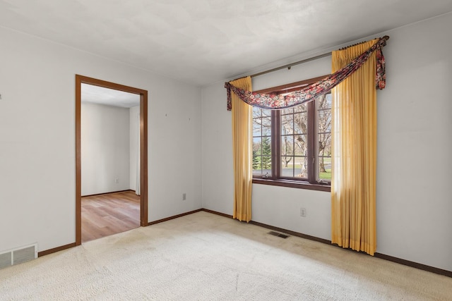 4675 Treat Hwy, Adrian, MI 49221 - unfurnished room with visible vents, baseboards, and carpet flooring