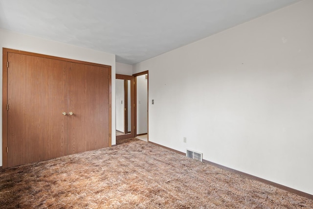 4675 Treat Hwy, Adrian, MI 49221 - unfurnished bedroom featuring visible vents, baseboards, a closet, and carpet floors
