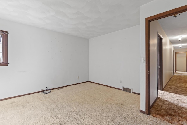 4675 Treat Hwy, Adrian, MI 49221 - empty room with visible vents, baseboards, and carpet floors