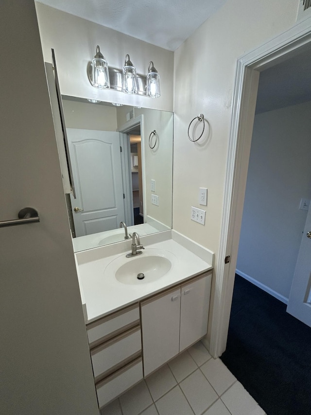 bathroom featuring vanity and tile patterned flooring