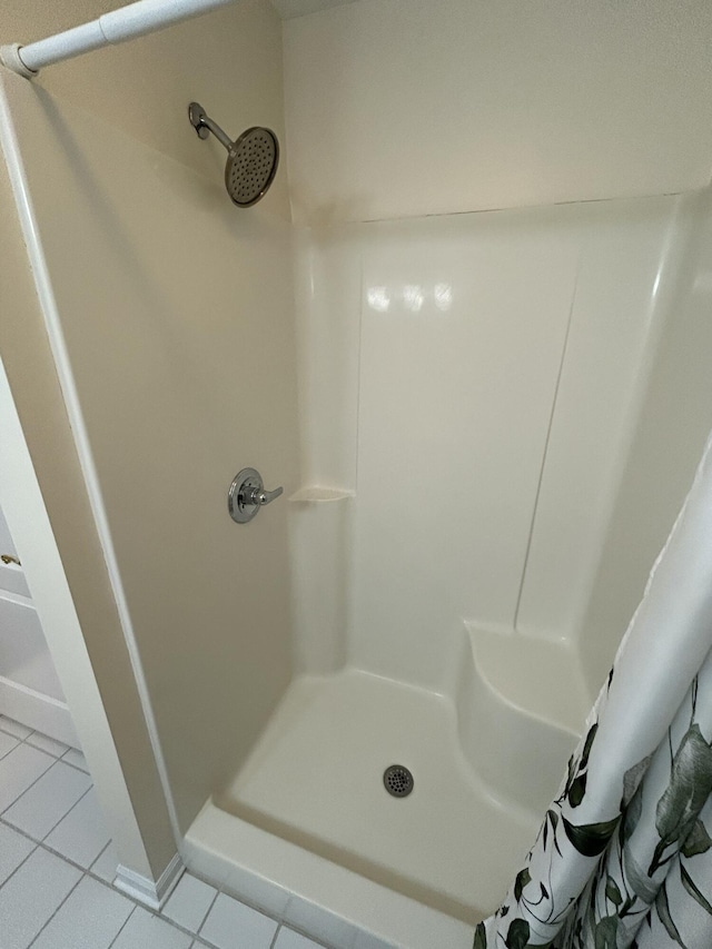 bathroom featuring tile patterned floors and walk in shower