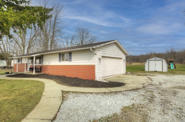 8550 Gratiot Ave, Columbus, MI 48063 - view of home's exterior featuring an outbuilding, a storage shed, a garage, concrete driveway, and brick siding