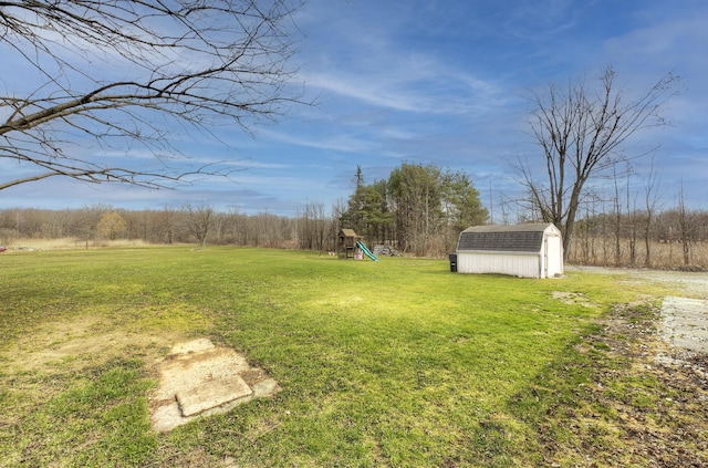 8550 Gratiot Ave, Columbus, MI 48063 - view of yard with an outbuilding, a playground, and a shed