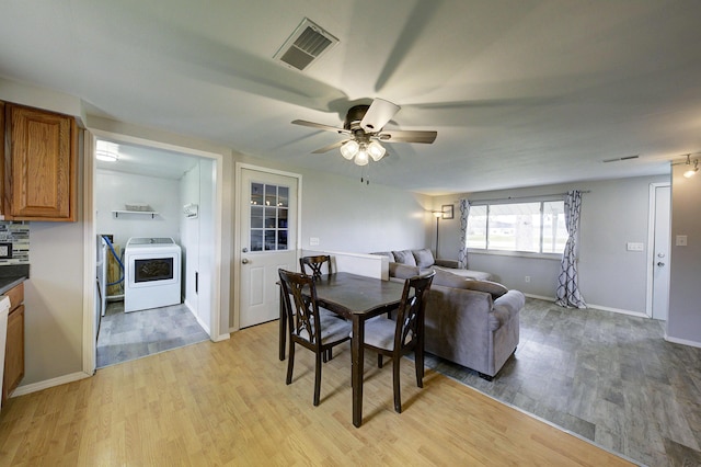 8550 Gratiot Ave, Columbus, MI 48063 - dining space with baseboards, light wood-style flooring, a ceiling fan, washer / dryer, and visible vents