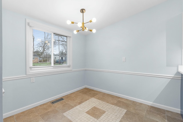2817 Cumberland Ave, Ann Arbor, MI 48104 - unfurnished room featuring a chandelier, baseboards, and visible vents