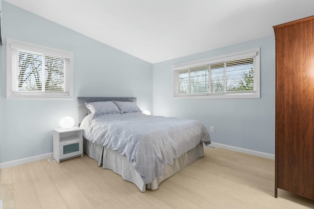 2817 Cumberland Ave, Ann Arbor, MI 48104 - bedroom featuring light wood-style floors, multiple windows, and baseboards